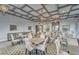 Refined game room with multiple tables, comfortable seating, and chic overhead lighting fixtures at 16927 April Plush Dr, Wimauma, FL 33598