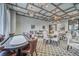 Elegant game room with poker table, seating, stylish lighting, and sophisticated decor at 16927 April Plush Dr, Wimauma, FL 33598