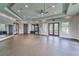 Well-lit gym featuring mirrored walls, and ample space for various fitness activities at 16927 April Plush Dr, Wimauma, FL 33598