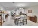 Open layout joining kitchen with bar seating to dining area, for easy conversation and entertaining at 16927 April Plush Dr, Wimauma, FL 33598