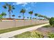 Palm trees line the perimeter fence of this property at 16927 April Plush Dr, Wimauma, FL 33598
