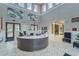 Modern lobby with high ceilings, stylish reception area, and comfortable seating at 16927 April Plush Dr, Wimauma, FL 33598
