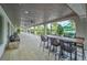 Outdoor patio with ceiling fans and large tables, perfect for gathering at 16927 April Plush Dr, Wimauma, FL 33598