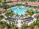 Aerial view of a community pool with palm trees, lounge chairs, and pergolas at 16927 April Plush Dr, Wimauma, FL 33598