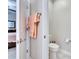 Small toilet room features tile floors, a toilet and towel rack at 16927 April Plush Dr, Wimauma, FL 33598
