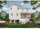 Charming backyard view with a patio area, lush landscaping, and a stylish two-story home at 1745 Massachusetts Ne Ave, St Petersburg, FL 33703