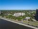A high angle view of a multi-story condominium complex near the waterfront and surrounding neighborhood at 2403 S Ardson Pl # 902B, Tampa, FL 33629