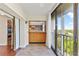 Balcony features sliding glass door access, bright sunlight, and views into the kitchen at 2403 S Ardson Pl # 902B, Tampa, FL 33629