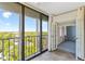 Balcony with sliding glass door access and views of the surrounding cityscape and trees at 2403 S Ardson Pl # 902B, Tampa, FL 33629