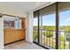 Balcony features views of the surrounding cityscape, sliding glass doors, and tiled flooring at 2403 S Ardson Pl # 902B, Tampa, FL 33629