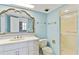 Well-lit bathroom features vanity, ornate mirror, toilet, and shower, providing a functional layout at 2403 S Ardson Pl # 902B, Tampa, FL 33629