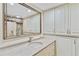 Well-lit bathroom featuring a vanity with granite countertop, large mirror and ample cabinet space at 2403 S Ardson Pl # 902B, Tampa, FL 33629