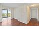 Bedroom with custom wall cabinets and drawers with a view into a balcony at 2403 S Ardson Pl # 902B, Tampa, FL 33629