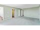 Spacious bedroom with soft green walls and doorways to closets and bathroom at 2403 S Ardson Pl # 902B, Tampa, FL 33629