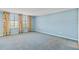 Spacious bedroom features floral curtains offering natural light and a calming blue palette at 2403 S Ardson Pl # 902B, Tampa, FL 33629