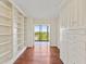 Bedroom with custom wall cabinets and shelving with views of the surrounding cityscape at 2403 S Ardson Pl # 902B, Tampa, FL 33629