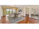 Elegant dining room featuring chandelier, modern table set, and balcony access at 2403 S Ardson Pl # 902B, Tampa, FL 33629