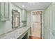 Dressing room boasts marble counter, mirror and leads into well-organized closet space at 2403 S Ardson Pl # 902B, Tampa, FL 33629