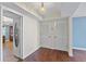 Inviting entryway featuring hardwood floors, decorative lighting, and access to other rooms in the unit at 2403 S Ardson Pl # 902B, Tampa, FL 33629