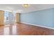 Bright living room with hardwood floors and ample windows offers views of the city skyline at 2403 S Ardson Pl # 902B, Tampa, FL 33629
