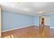 Spacious living room with hardwood floors is illuminated by decorative ceiling lights and natural light at 2403 S Ardson Pl # 902B, Tampa, FL 33629