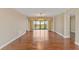 Bright living room featuring hardwood floors, chandelier and access to an outdoor balcony at 2403 S Ardson Pl # 902B, Tampa, FL 33629