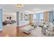 Stylish living room with hardwood floors, custom built-ins, and comfortable seating arrangements at 2403 S Ardson Pl # 902B, Tampa, FL 33629