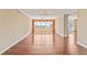 Spacious living room with hardwood floors and floor to ceiling windows with a water view at 2403 S Ardson Pl # 902B, Tampa, FL 33629