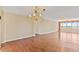 Open living room with hardwood floors and a water view beyond the expansive windows at 2403 S Ardson Pl # 902B, Tampa, FL 33629