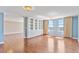 Open living room features hardwood floors and custom built-in cabinets, offering lots of space for living at 2403 S Ardson Pl # 902B, Tampa, FL 33629