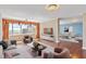 Spacious living room with hardwood floors offers stunning views from large windows and comfortable furnishings at 2403 S Ardson Pl # 902B, Tampa, FL 33629