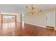 Open living area with hardwood floors, chandelier, and many windows at 2403 S Ardson Pl # 902B, Tampa, FL 33629