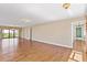 Spacious living room with hardwood floors, chandelier and access to an outdoor balcony at 2403 S Ardson Pl # 902B, Tampa, FL 33629