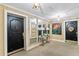 Building lobby featuring black doors, a mirrored wall and artwork at 2403 S Ardson Pl # 902B, Tampa, FL 33629