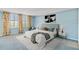 Stylishly furnished bedroom with blue walls, two windows and floral curtains for a soothing retreat at 2403 S Ardson Pl # 902B, Tampa, FL 33629