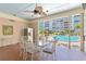 Relax in the shade of the pool house near the pool, featuring outdoor dining and gathering spaces at 2403 S Ardson Pl # 902B, Tampa, FL 33629