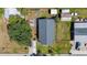 Aerial view of the home, showcasing the roof, yard, patio, and surrounding neighborhood at 2408 Linsey St, Tampa, FL 33605