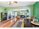 Spacious living room with hardwood floors, elegant archways, and stylish furnishings creating a warm and inviting atmosphere at 2408 Linsey St, Tampa, FL 33605