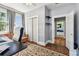 Office space with a comfortable sofa, closet space and views into another bedroom at 2408 Linsey St, Tampa, FL 33605