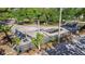 Outdoor Skate Park with ramps, rails, and platforms surrounded by trees and fencing at 2408 Linsey St, Tampa, FL 33605
