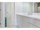 Bathroom featuring a white vanity, mirror, and tile floor at 2927 W Bayshore Ct, Tampa, FL 33611