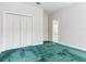 Bedroom featuring carpet, bi-fold closet, and an ensuite bathroom at 2927 W Bayshore Ct, Tampa, FL 33611