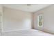 Neutral bedroom features natural light and a ceiling fan at 2927 W Bayshore Ct, Tampa, FL 33611