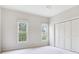 Bedroom includes a closet and natural light from two windows at 2927 W Bayshore Ct, Tampa, FL 33611