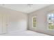 Well-lit bedroom featuring neutral tones, carpet, and natural light at 2927 W Bayshore Ct, Tampa, FL 33611
