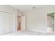 Bedroom with ensuite bathroom and large closet featuring neutral tones at 2927 W Bayshore Ct, Tampa, FL 33611