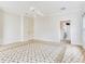 Large bedroom with floral carpet, ceiling fan, and ample space at 2927 W Bayshore Ct, Tampa, FL 33611