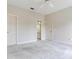 Neutral bedroom with ensuite bathroom access; carpeted floors, ample space at 2927 W Bayshore Ct, Tampa, FL 33611