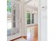 Entryway with a view of the chandelier lit dining room, and hardwood floors at 2927 W Bayshore Ct, Tampa, FL 33611