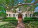 Inviting two-story home with manicured landscaping, featuring a classic design and a warm, welcoming facade at 2927 W Bayshore Ct, Tampa, FL 33611